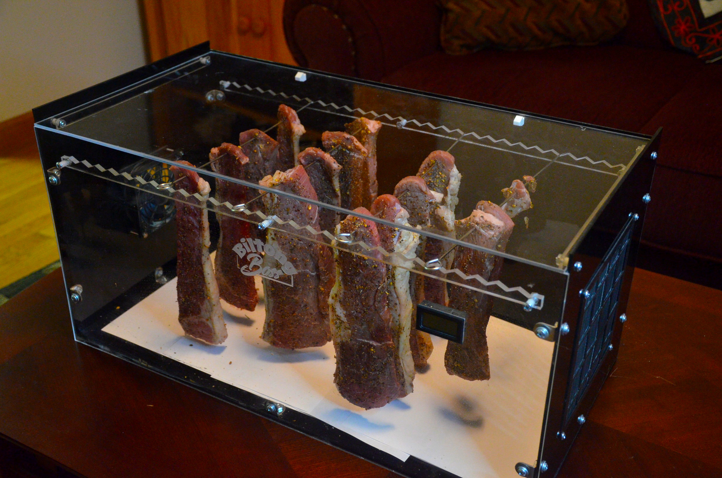 African on Table I photo of biltong hanging in Biltong Boss biltong dryer