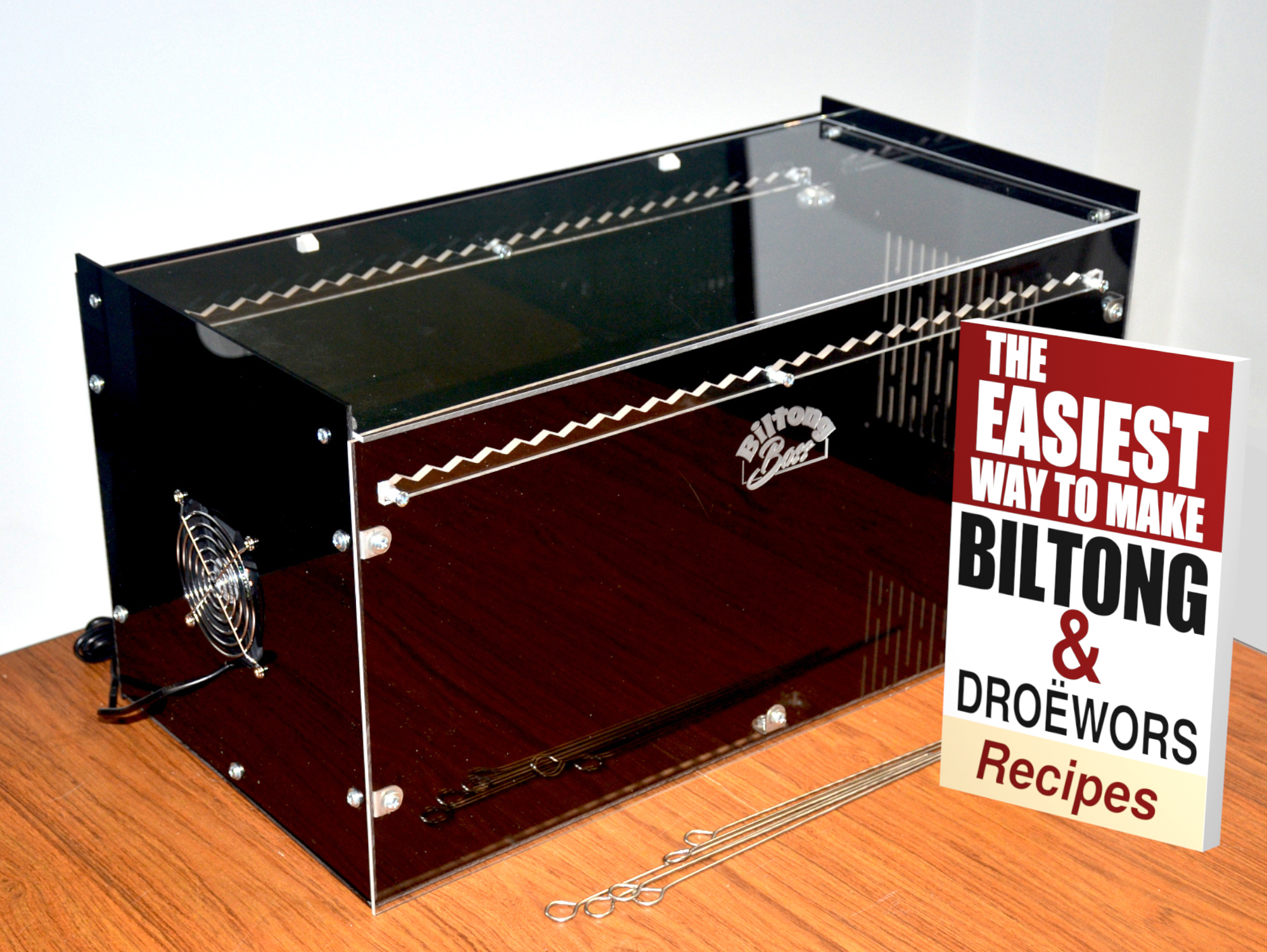 Mk.4 Cropped w book C1 Photo of Biltong Boss dryer with skewers and recipe book